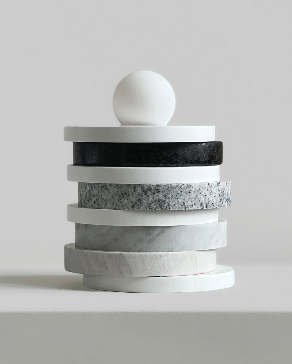 The design for Offcuts, Reimagined is modular. Stone rings are stacked in different ways to create sculptural effects.